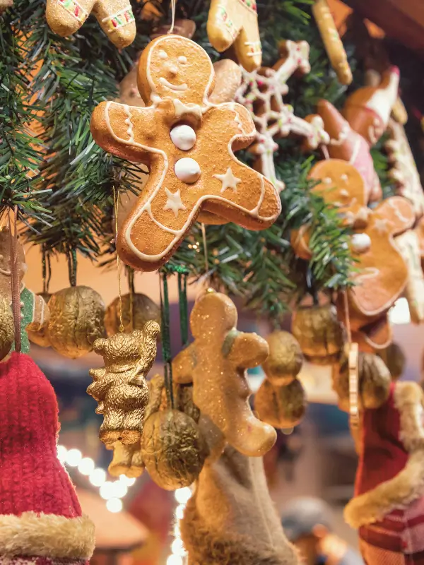 Festive gingerbread displayed on wooden stalls at a winter Christmas market in Italy