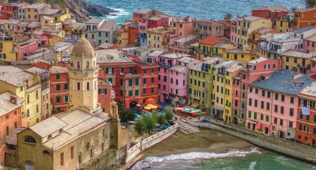 Iconic cliffside villages of Cinque Terre with sweeping views of the Mediterranean, perfect for an unforgettable Italian holiday.