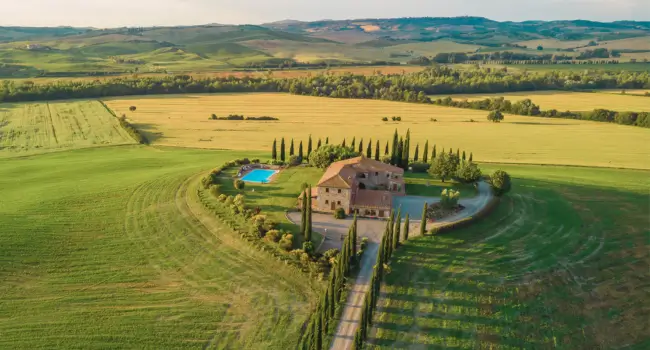 A serene Tuscan villa surrounded by countryside, offering an ideal retreat for a relaxing retirement holiday in Italy.