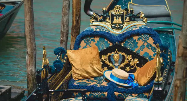 Luxurious gondola interior with plush cushions, comfortable for a romantic experience on a holiday in Venice.