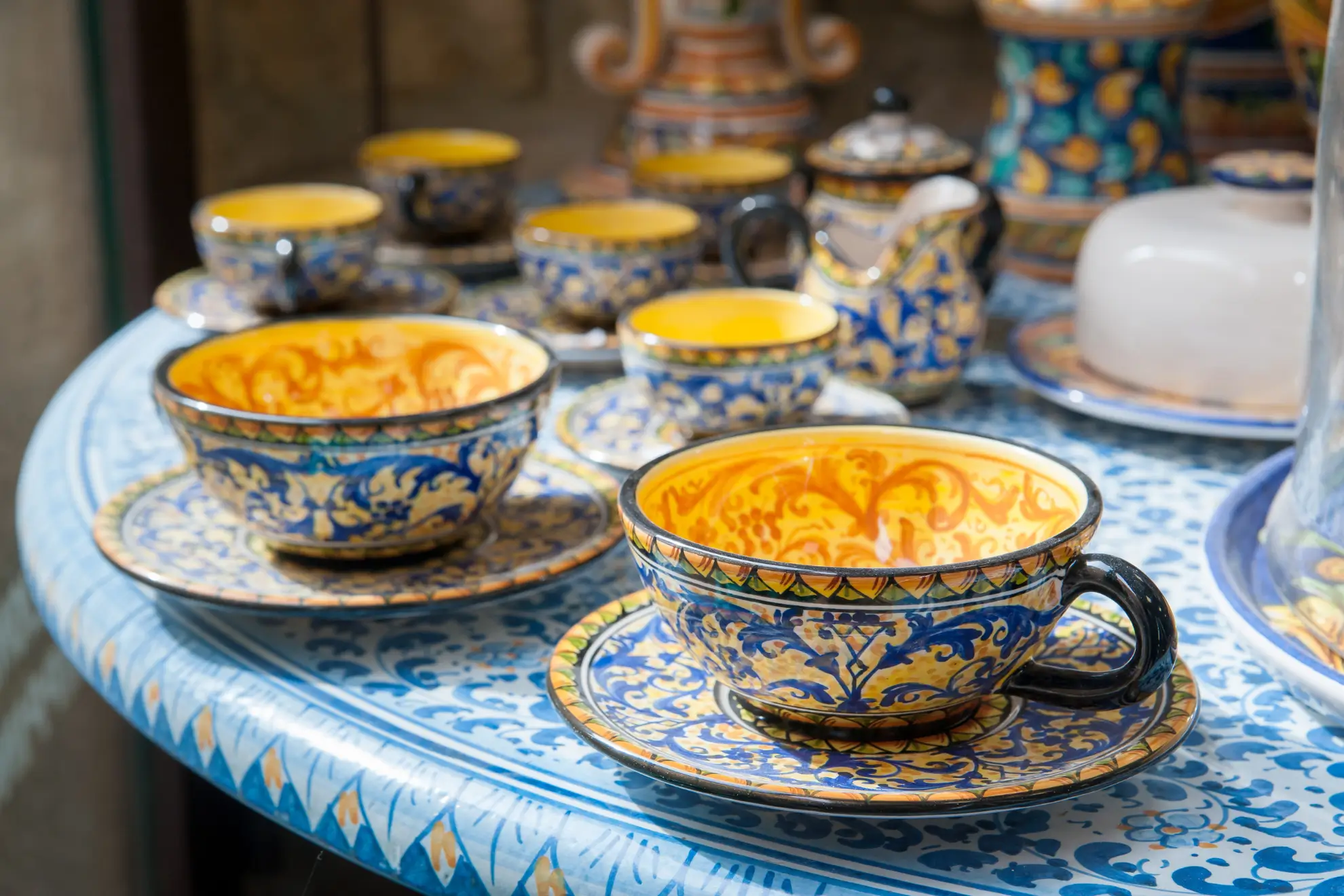 Handmade ceramic cups on a wooden table, ready for a thoughtful conversation.