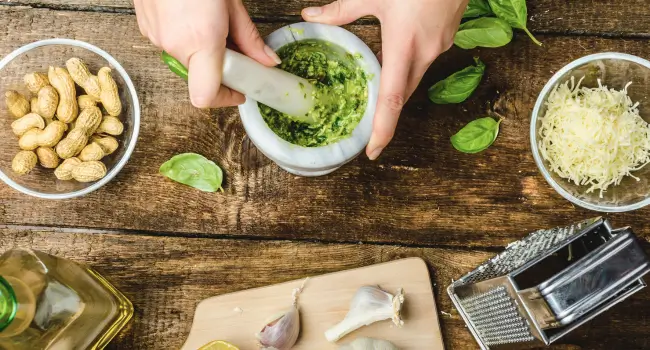 Fresh ingredients for pesto making lesson, perfect for a group or honeymoon with friends activity in Italy.