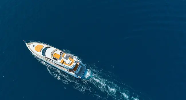 Luxury yacht sailing through the Mediterranean, perfect for a friendsmoon getaway.