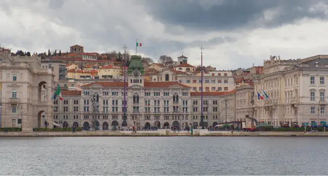 Wide-angle view of Piazza Unità d’Italia in Trieste from the pier, perfect for a Italian getaway.