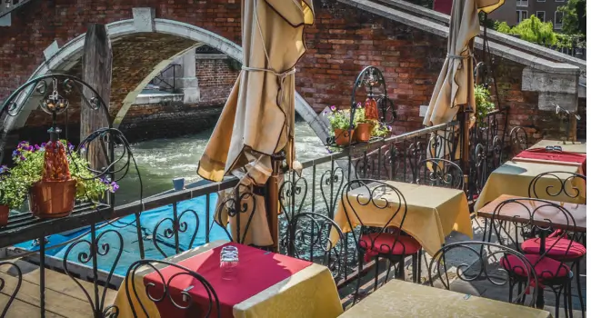Elegant restaurant overlooking a Venice canal, a wonderful spot for a birthday celebration.