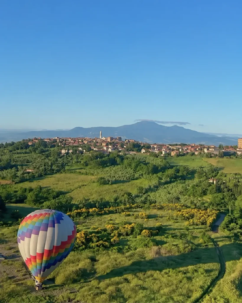 A hot air balloon over the Tuscan countryside