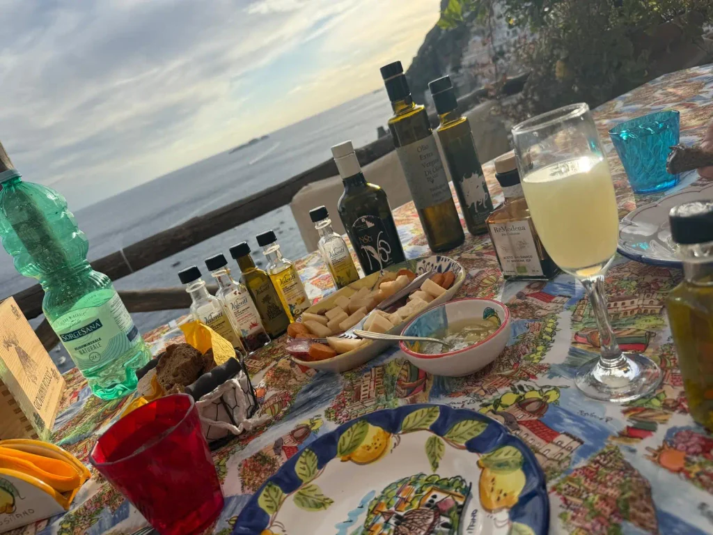 Limoncello workshop Positano, secret Amalfi Coast, tasting table above the sea with local products.