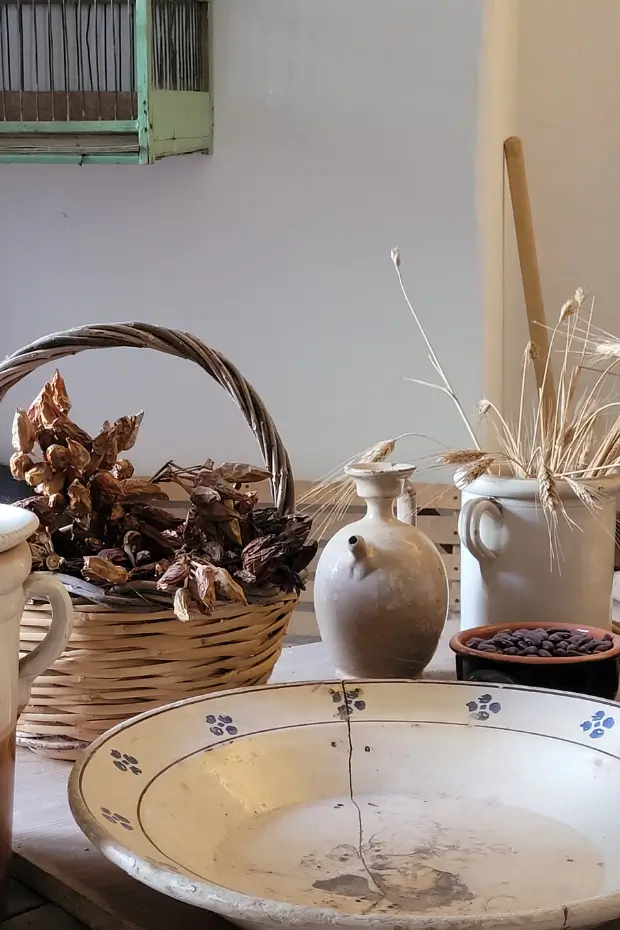 Step into this preserved kitchen inside Trullo Sovrano, where antique cooking tools tell stories of rural Italian life from a bygone era.
