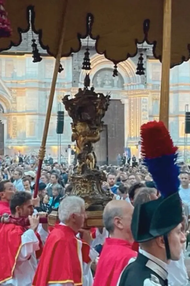 Traditional religious parade in Bologna seen during a private guided city tour