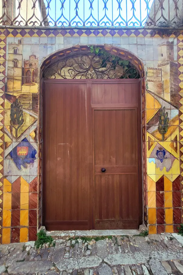 Ornate tiled doorway with Sicilian motifs in Erice.