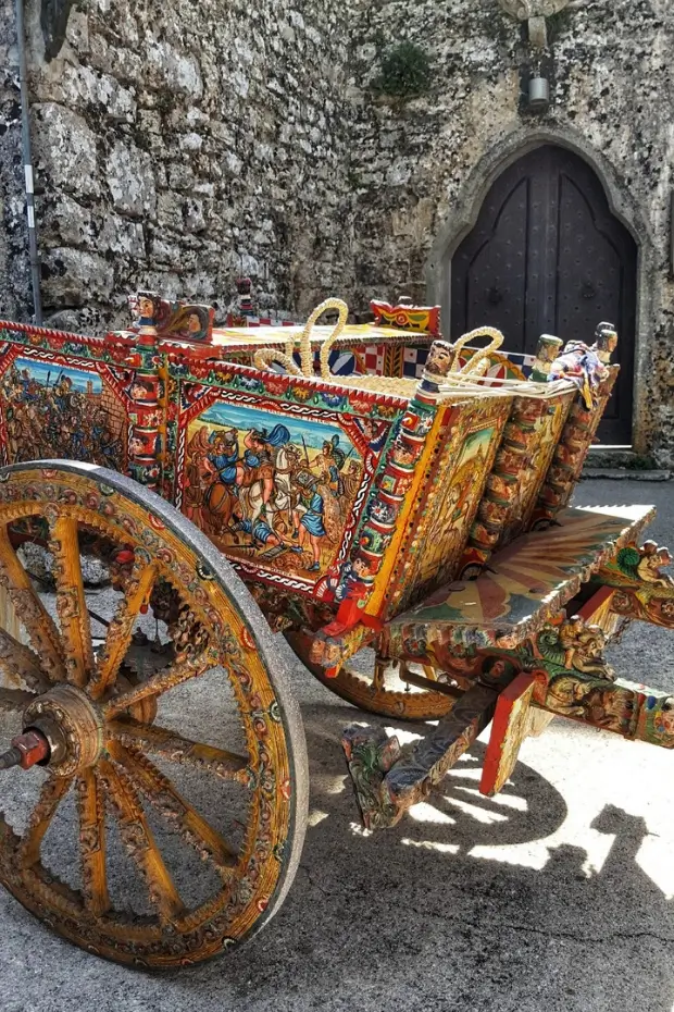 Colorful traditional Sicilian cart in Erice with detailed artwork.