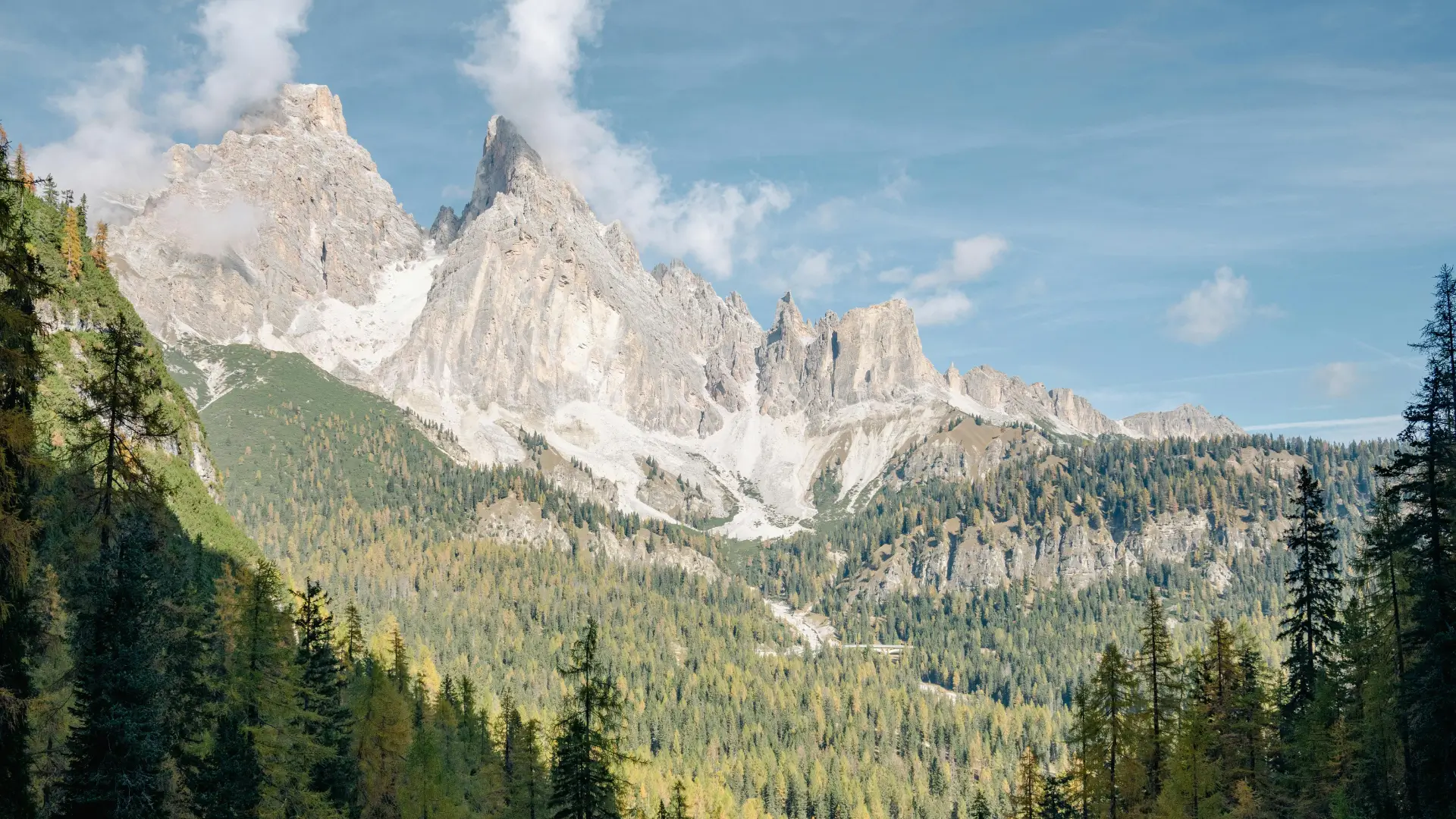 Italy Dolomites family holiday, dramatic Dolomites peaks and alpine forest landscape Trentino summer