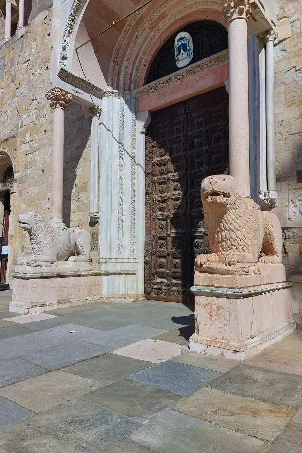 Romanesque lion sculptures at the entrance of Parma Cathedral.