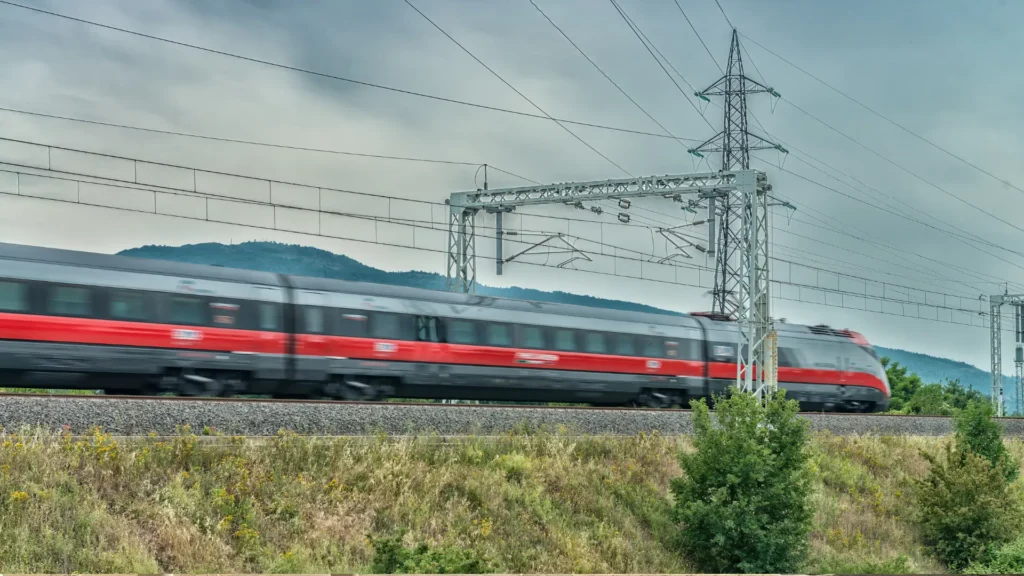 How to get around Italy with high speed trains: A family planning an Italy vacation itinerary using Frecciarossa and Italo at a major rail hub