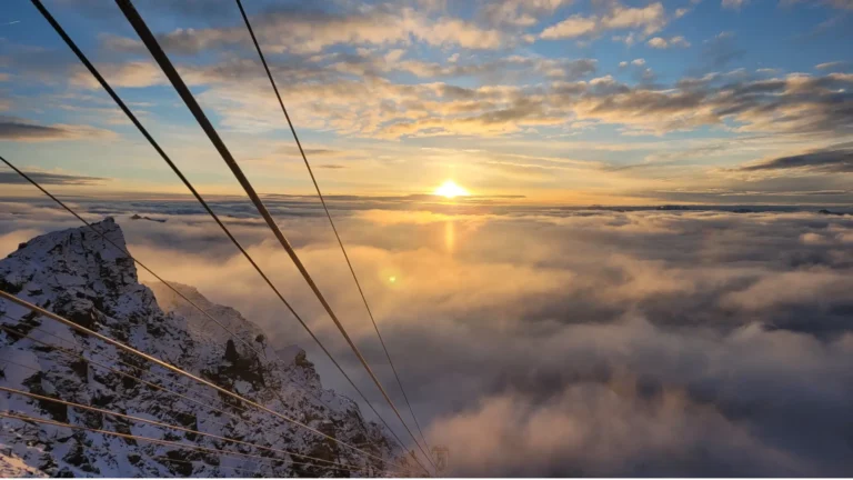 Dolomites winter family activities for non-skiers enjoying a luxury sunrise excursion at Sass Pordoi with a traditional Alpine breakfast in a mountain hut.